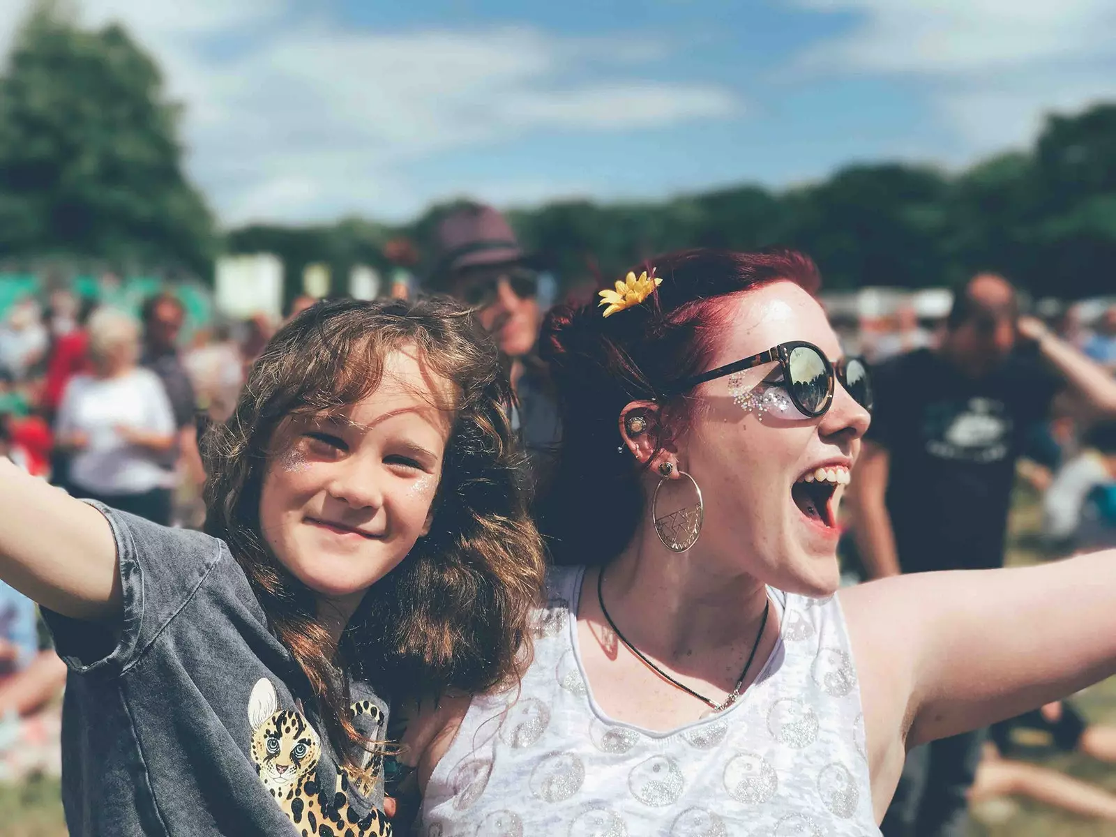 A woman and a girl at a music festival