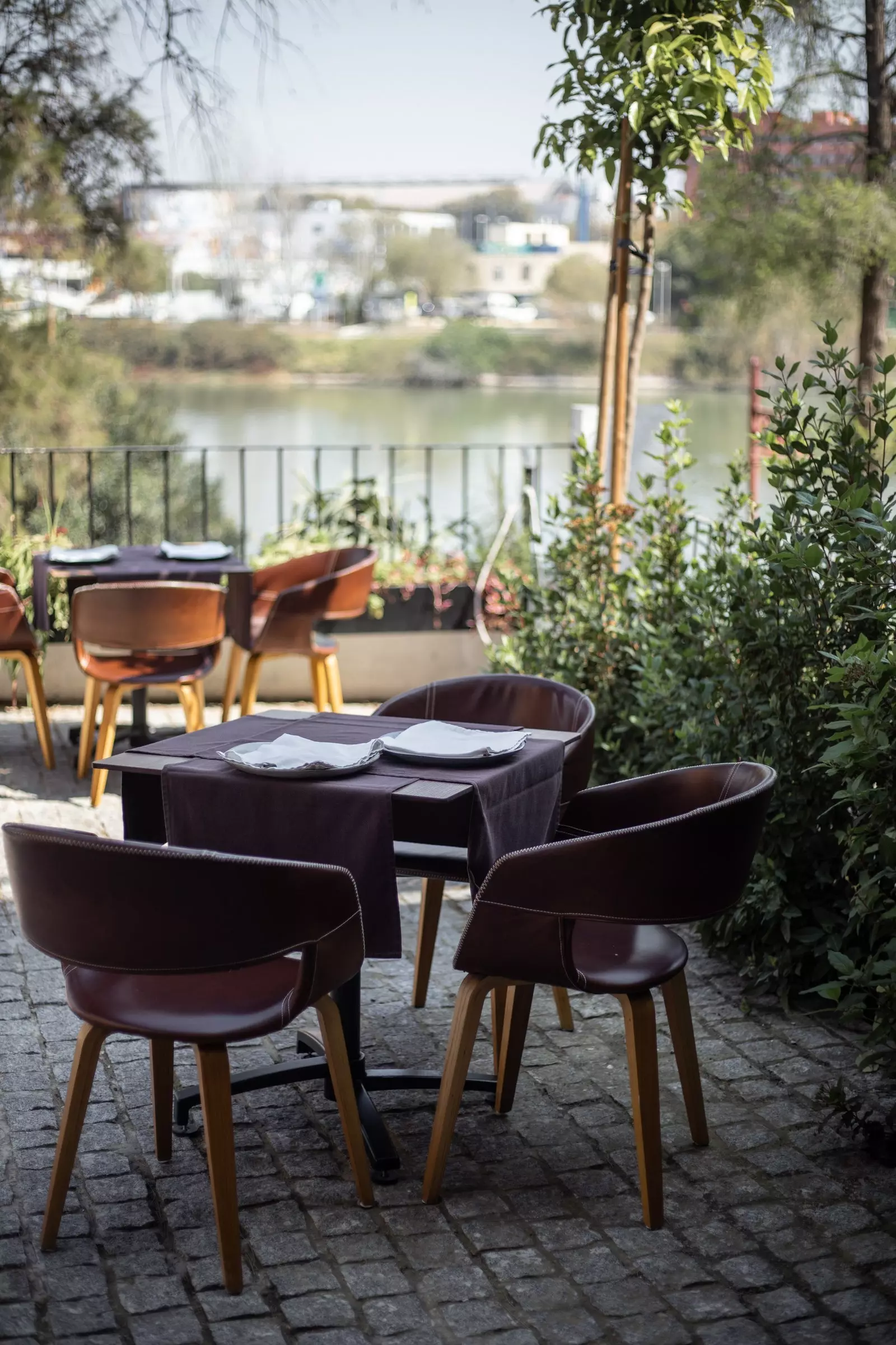 Terrace of the La O restaurant next to the historic riverbed of the Guadarquivir.