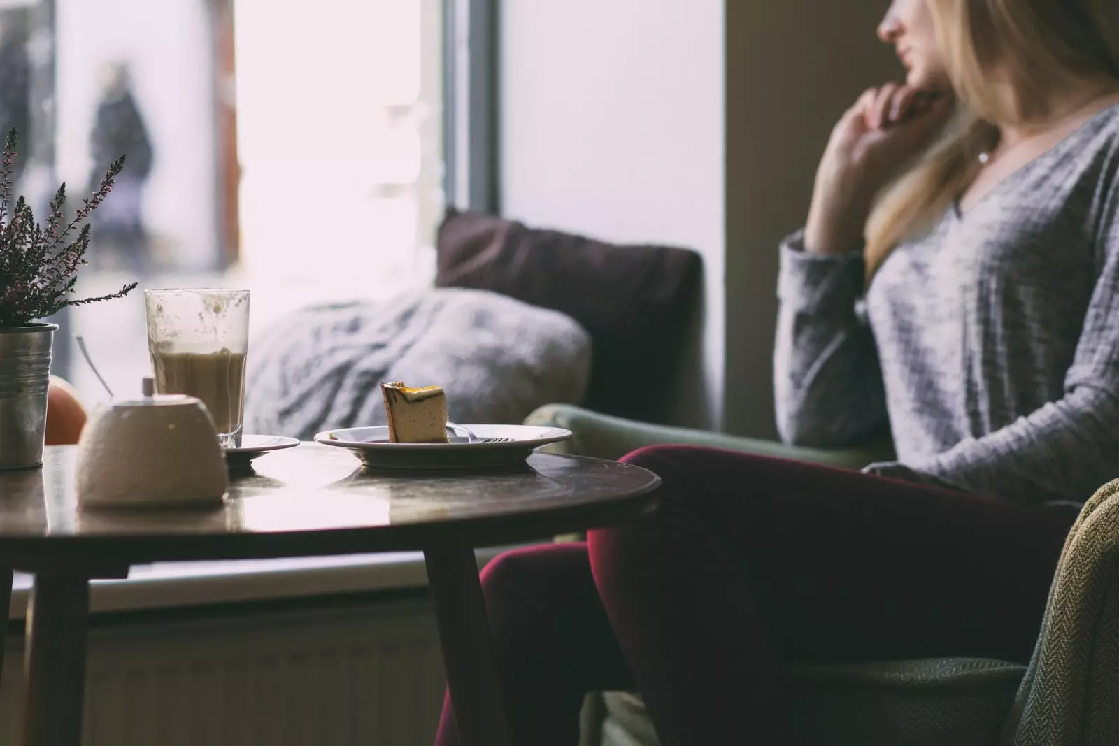 Woman having a biscuit for breakfast