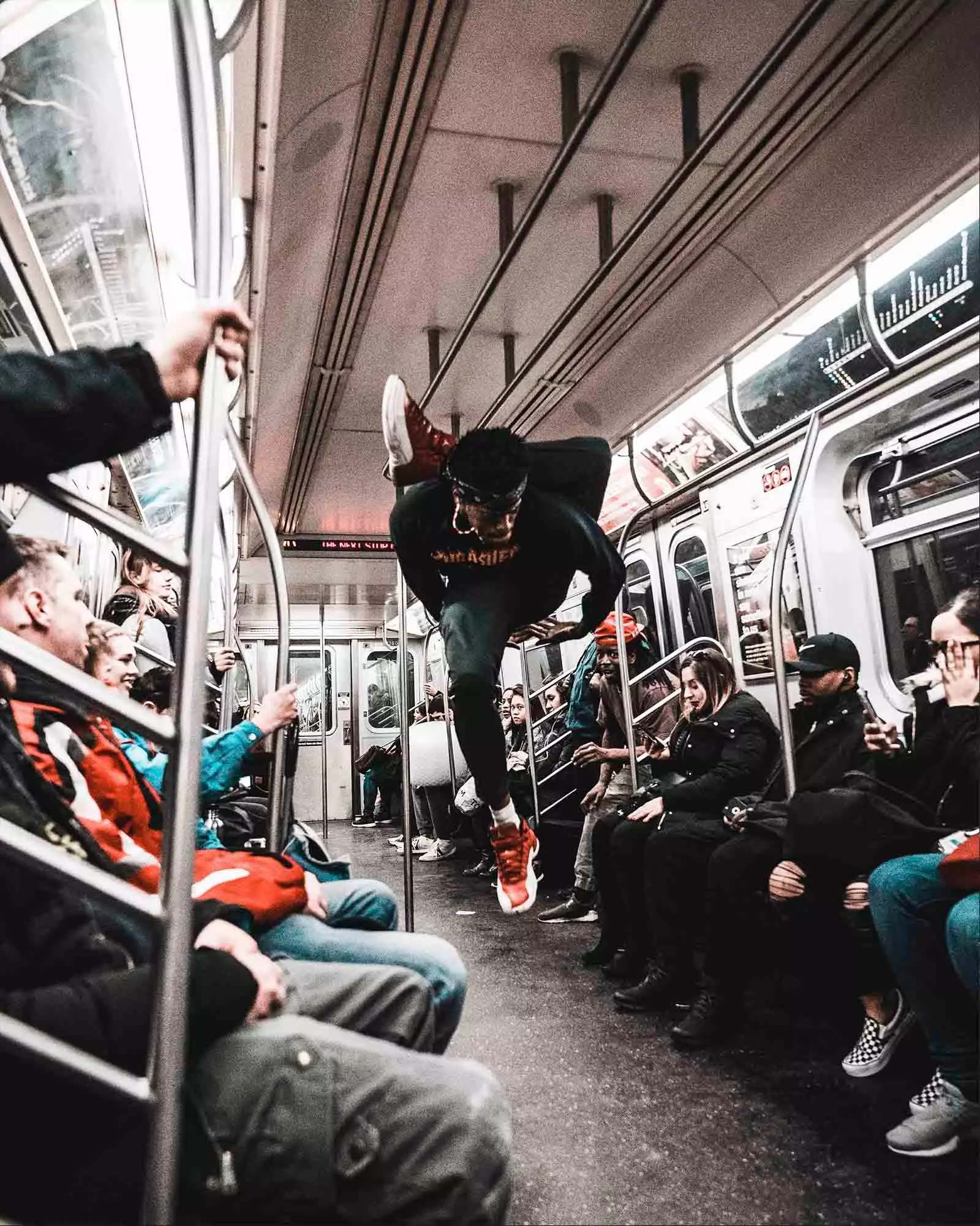 boy dancing in the new york subway