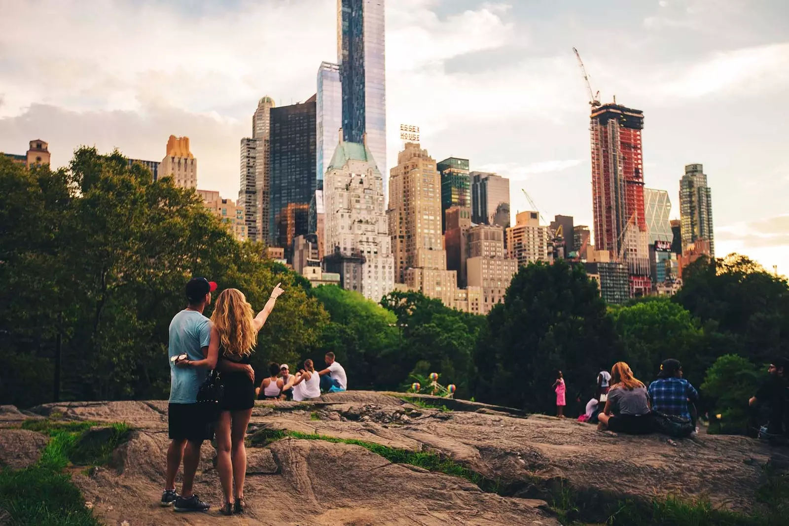 tourist couple pointing to buildings