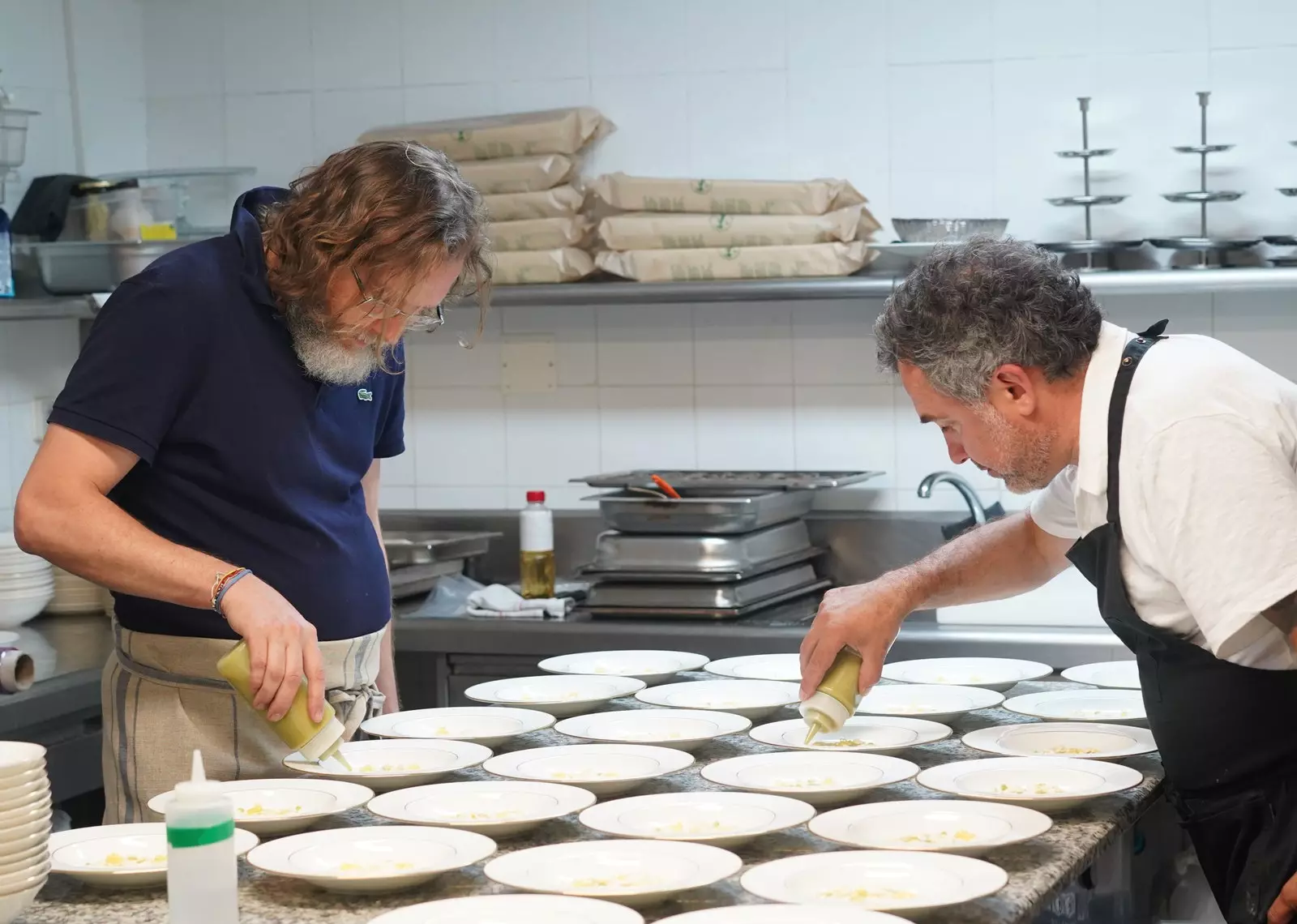 Chefs Rafa Peña and Albert Raurich preparing a four-handed dinner for the presentation of the new...