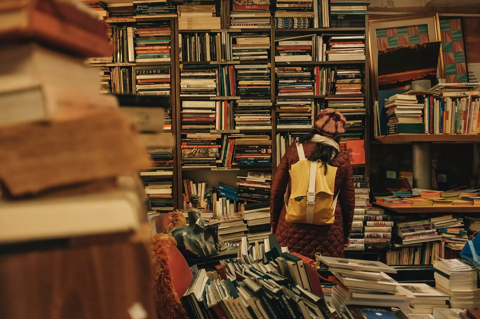 A girl searches in a bookstore