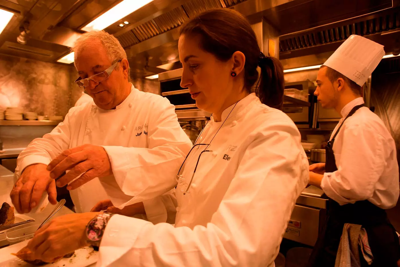 Elena and Juan Mari Arzak working in the kitchen