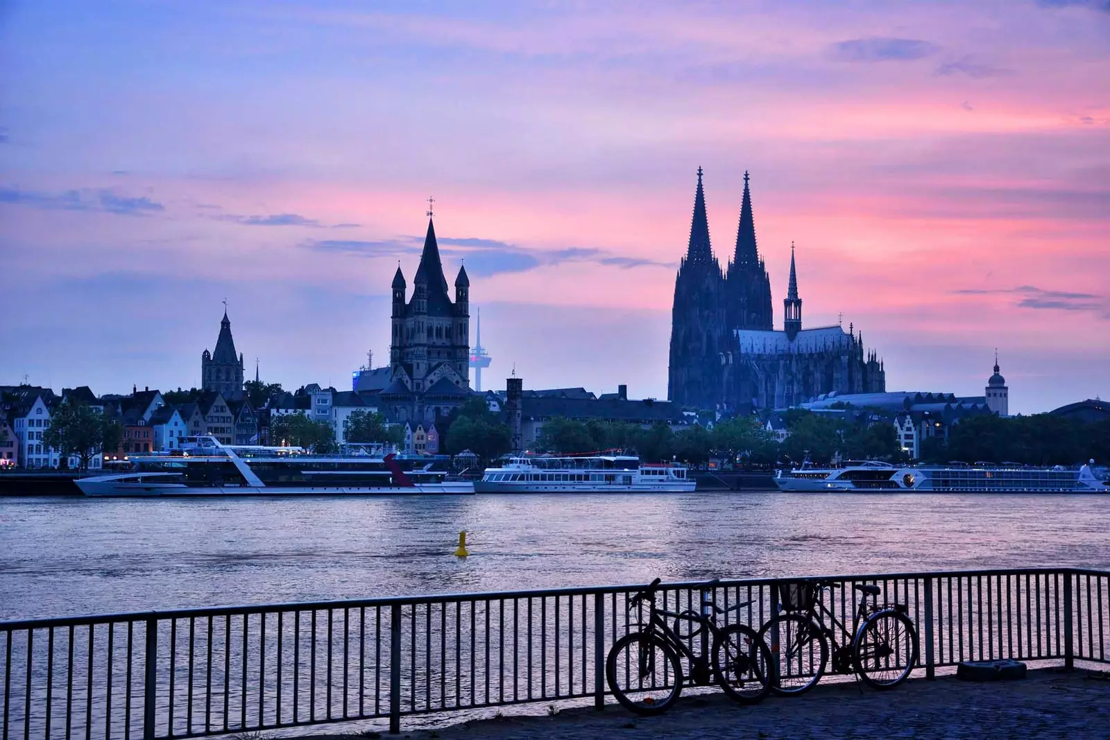 bicycles by the river in Colonia at sunset