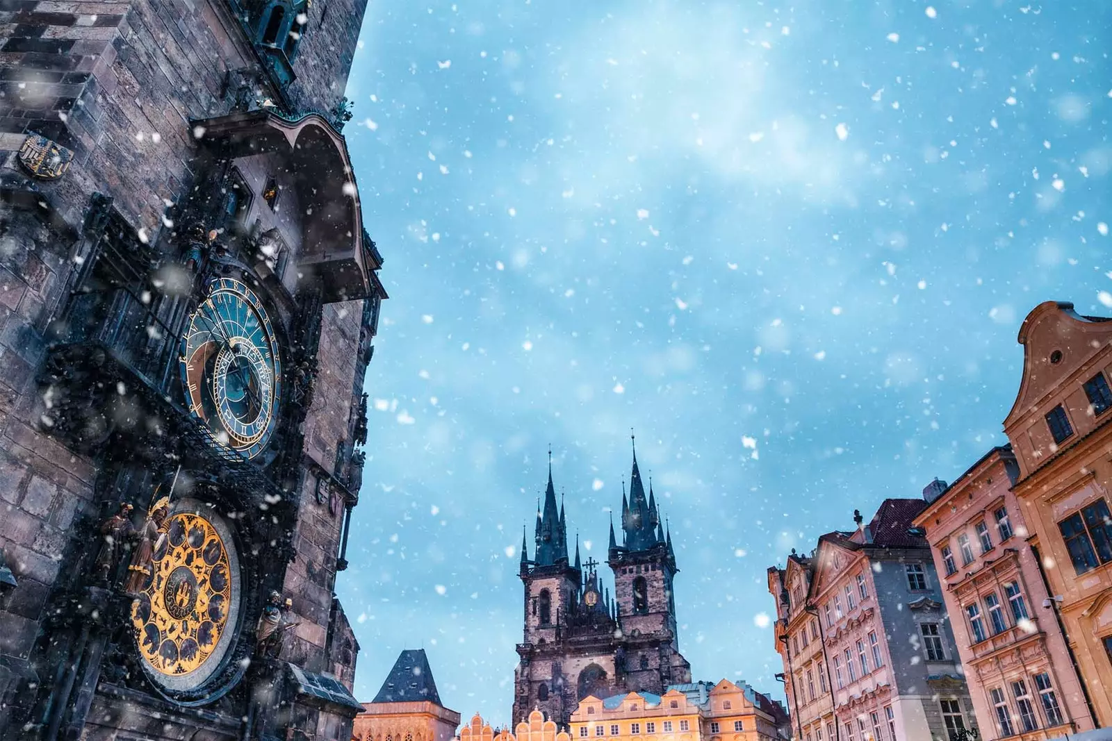 prague astronomical clock in square under snow