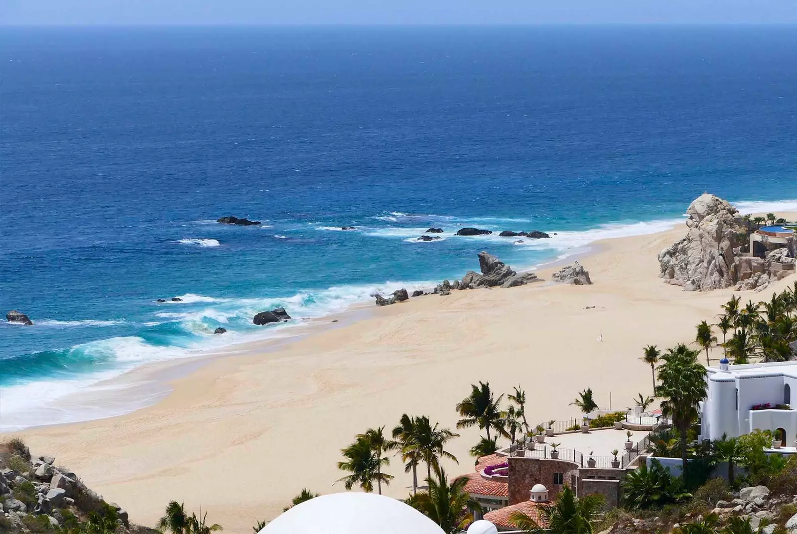 Cabo San Lucas arid landscapes, mountainous terrain and calm beaches