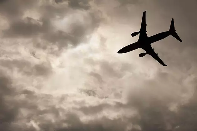 An airplane passes through a storm zone