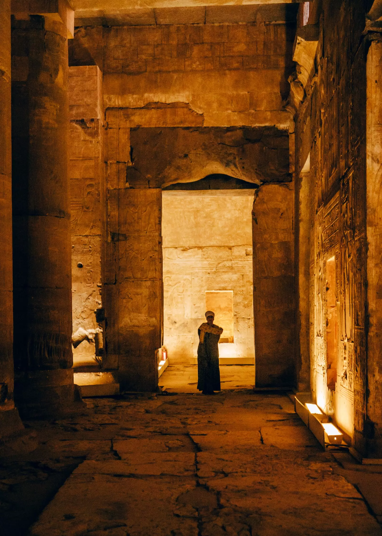 A person between the columns of an Egyptian temple