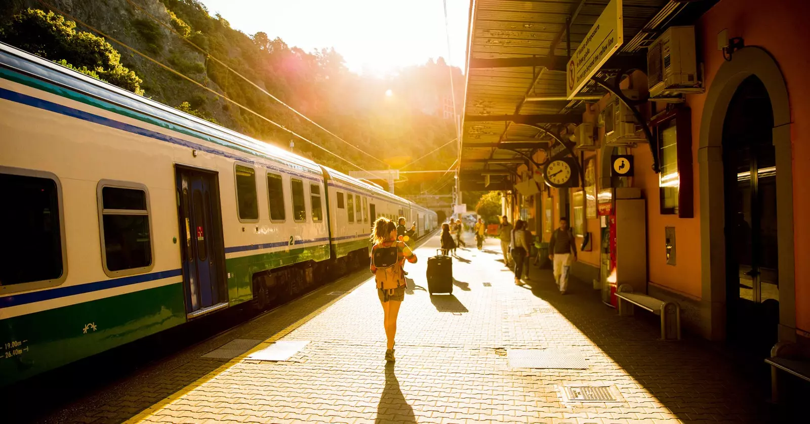 Woman walks by train platform