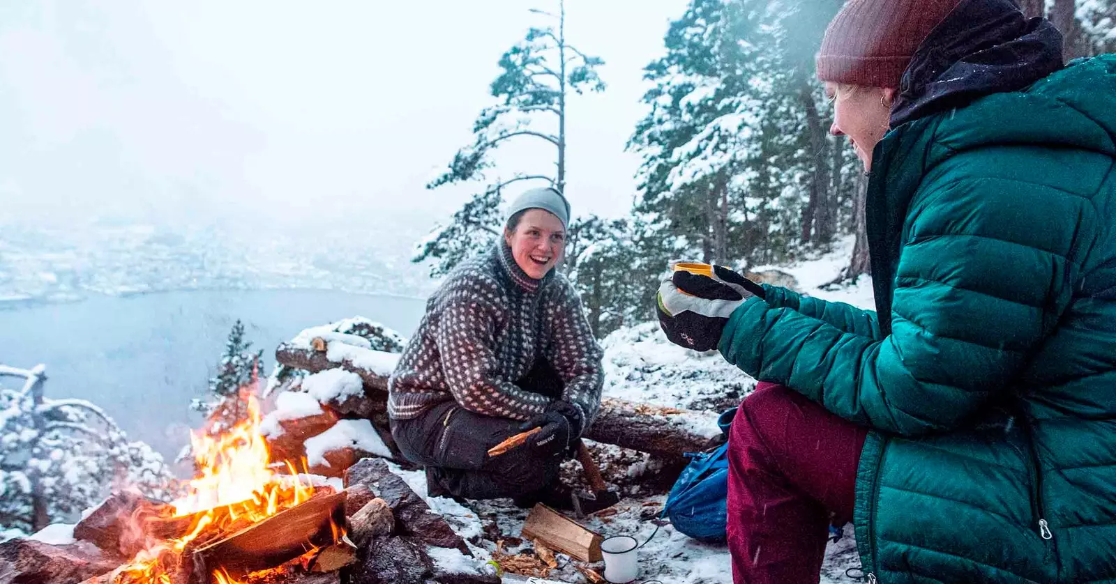 couple with a campfire in norway