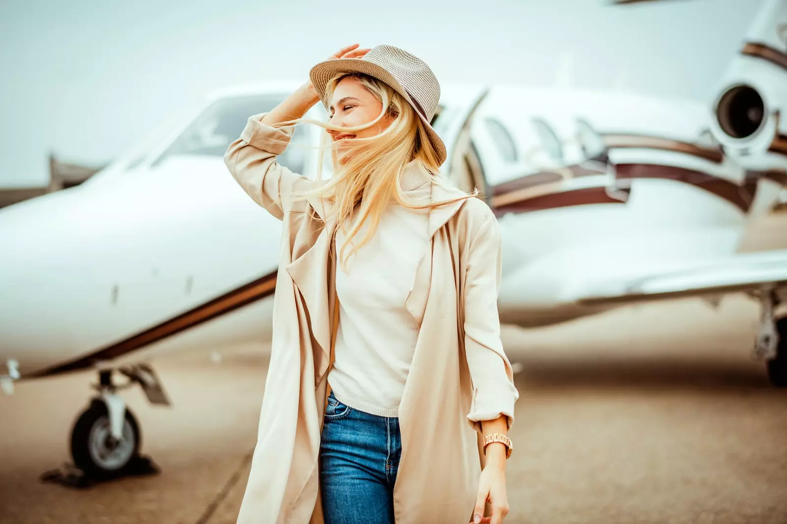 Woman getting off a private plane