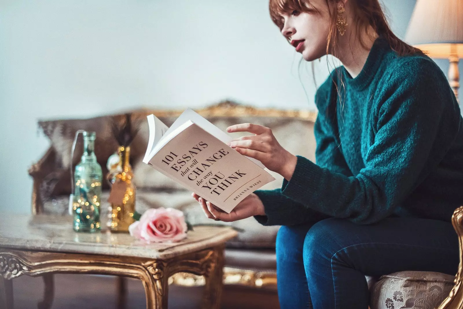 Woman reading book in a living room