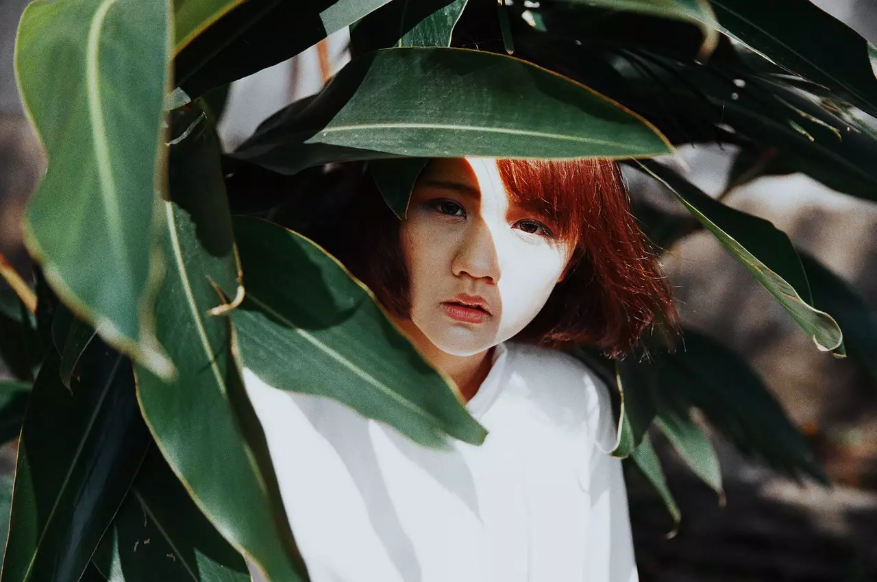 Asian woman among the vegetation