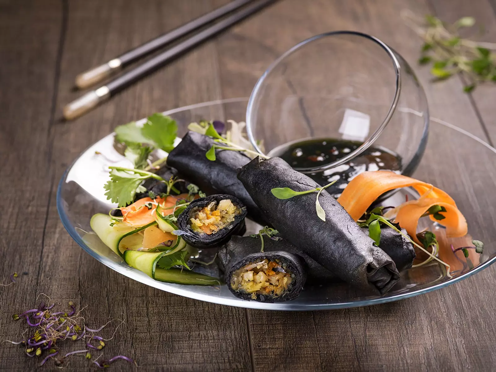 Fine vegetable rolls wrapped in rice paste and cuttlefish ink the star dish