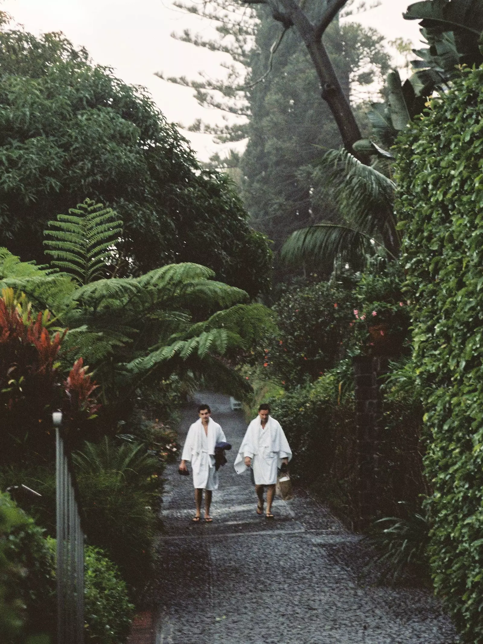 A couple in the gardens of the Hotel Belmond Reids Palace Madeira Portugal