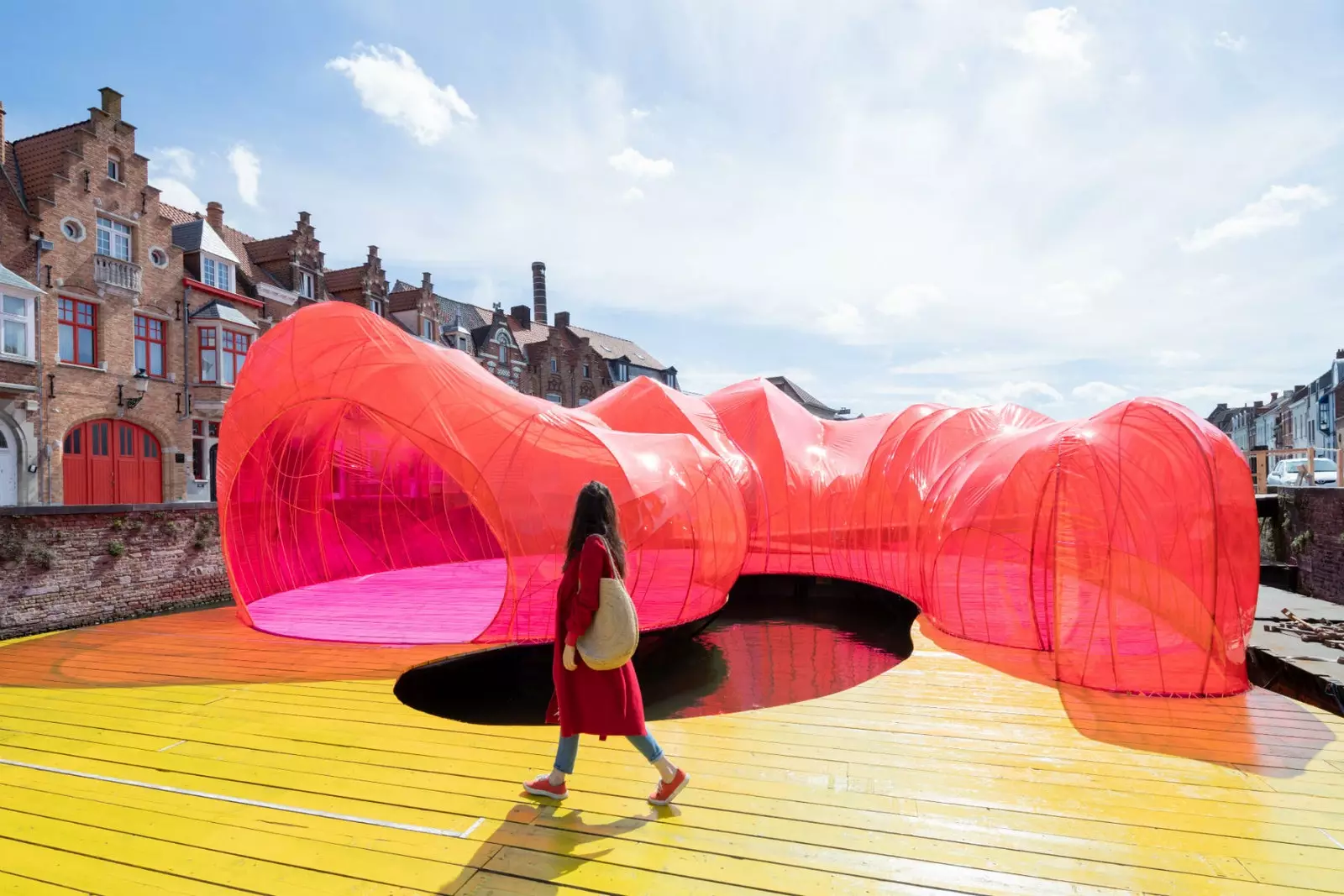 Floating pavilion of the Spanish studio SelgasCano a tropical explosion over the calm Coupure channel.