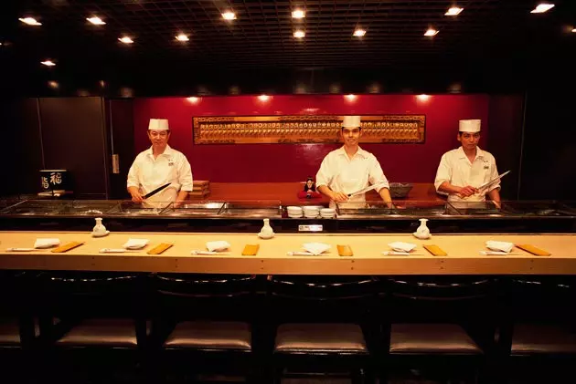 Sushi masters in a restaurant