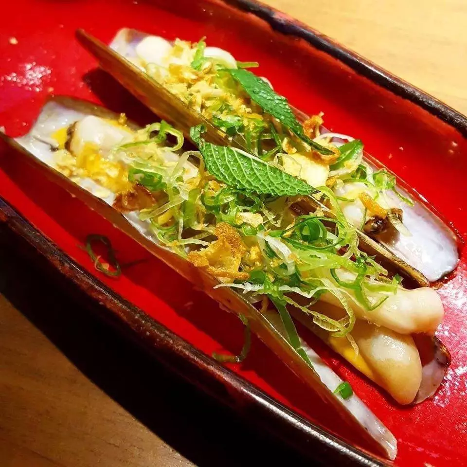 Open razor clams wok with yellow chili and asparagus from Umiko