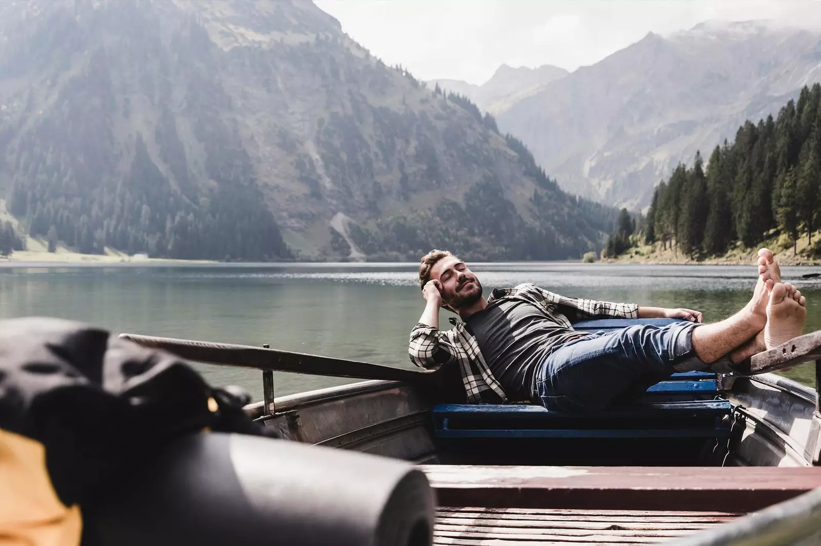 boy resting in a boat