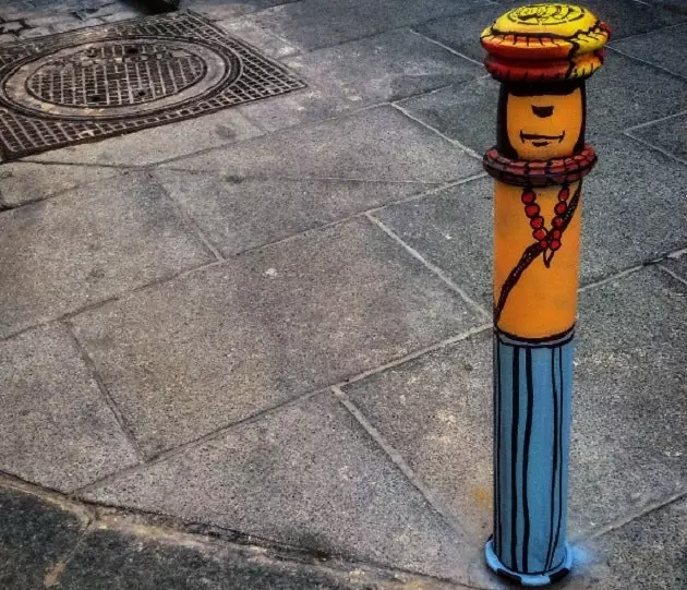 Urban art paints the gray of a Madrid street with color