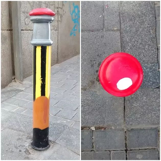 Kunst schildert het grijs van een straat in Madrid met kleur