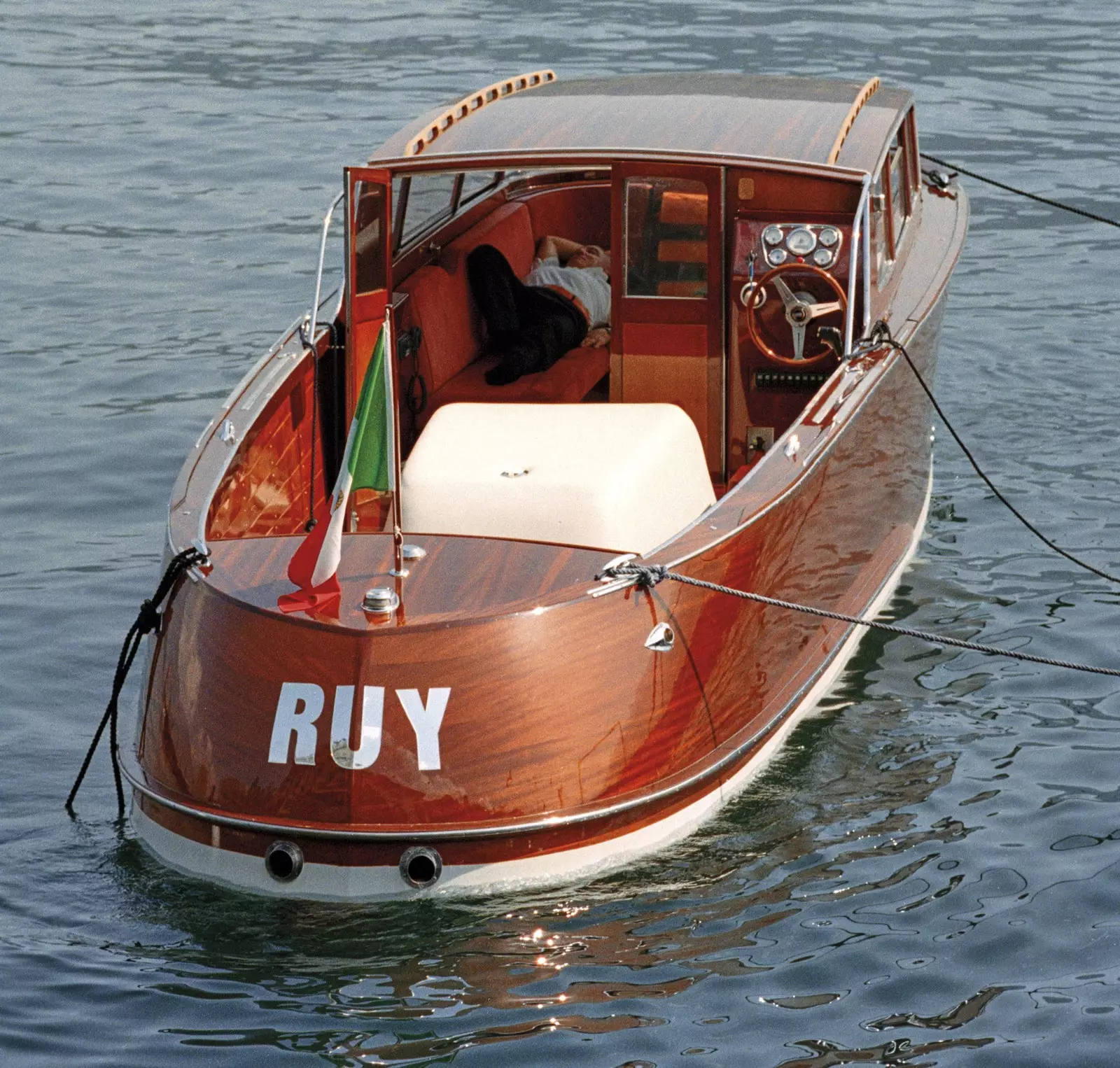 A boat with its captain waiting for clients.