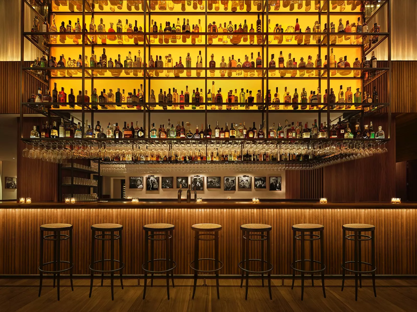 The central wooden bar of Bar Veraz with its collection of bottles in the impressive steel structure that dominates...