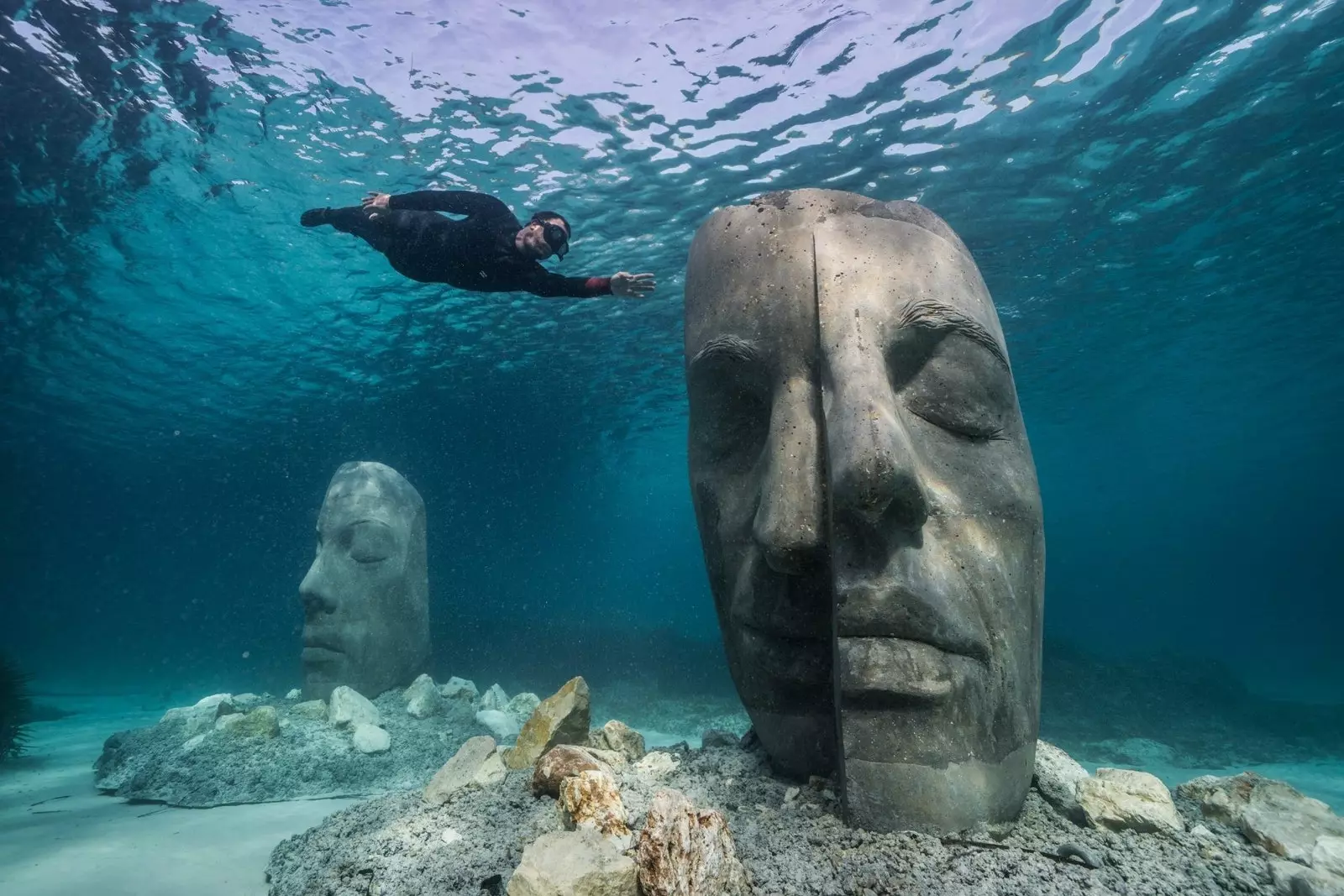 The faces correspond to six citizens of Cannes