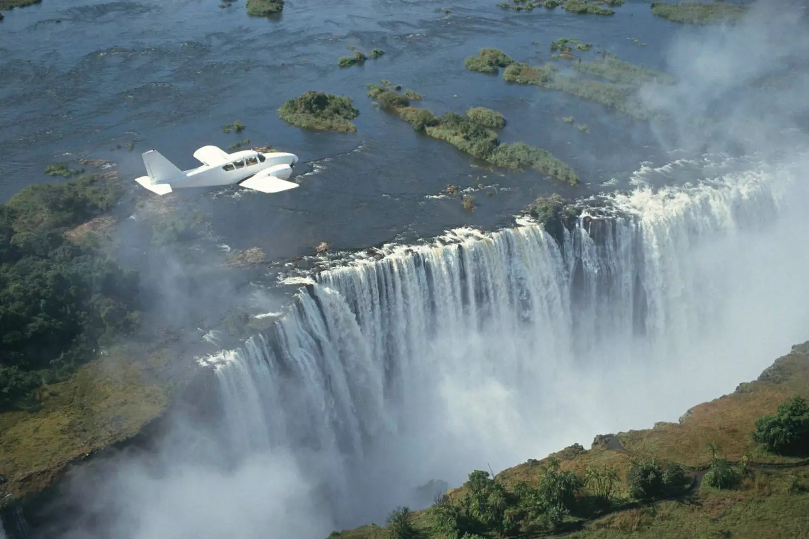 plane flying over victoria falls