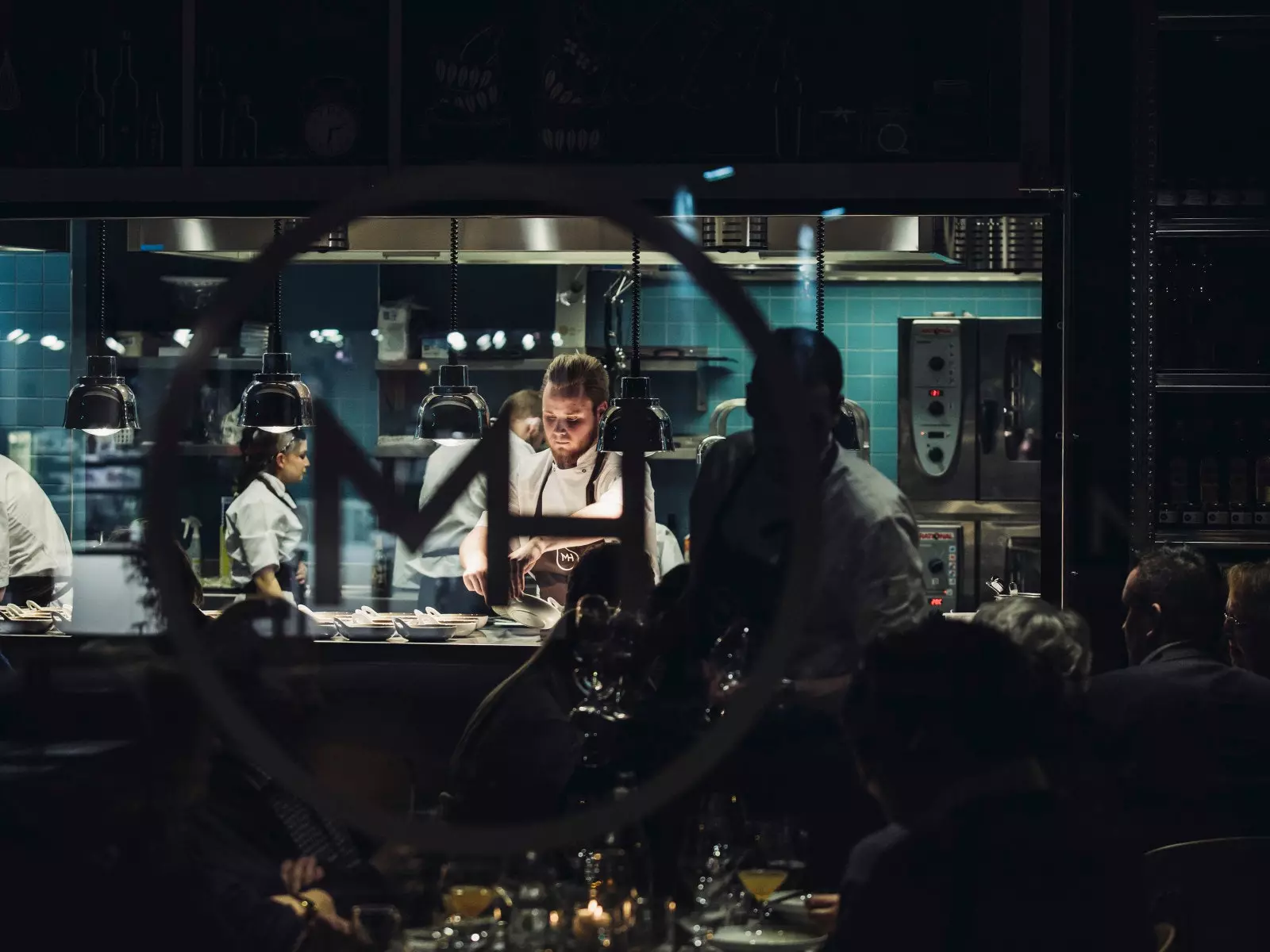 Mathallen Tromsø's open kitchen with its busy cooks.