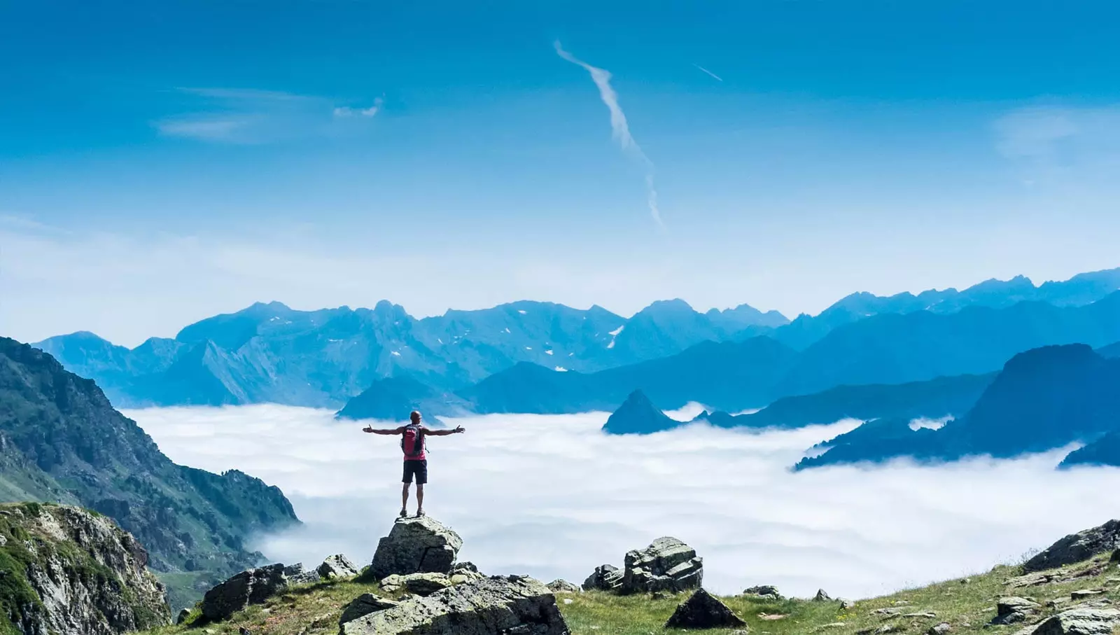 man på bergstoppen