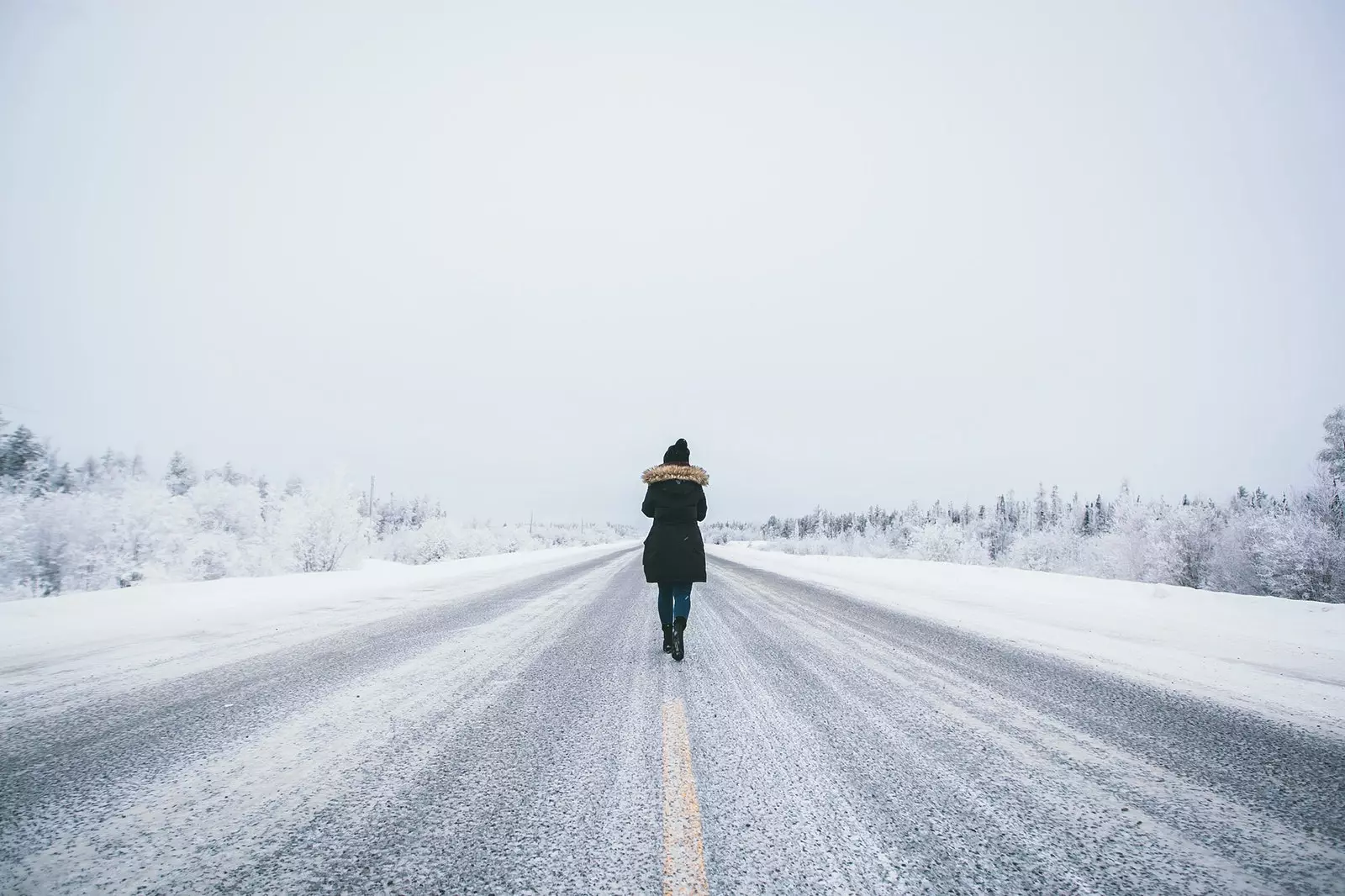 Woman walking on icy road