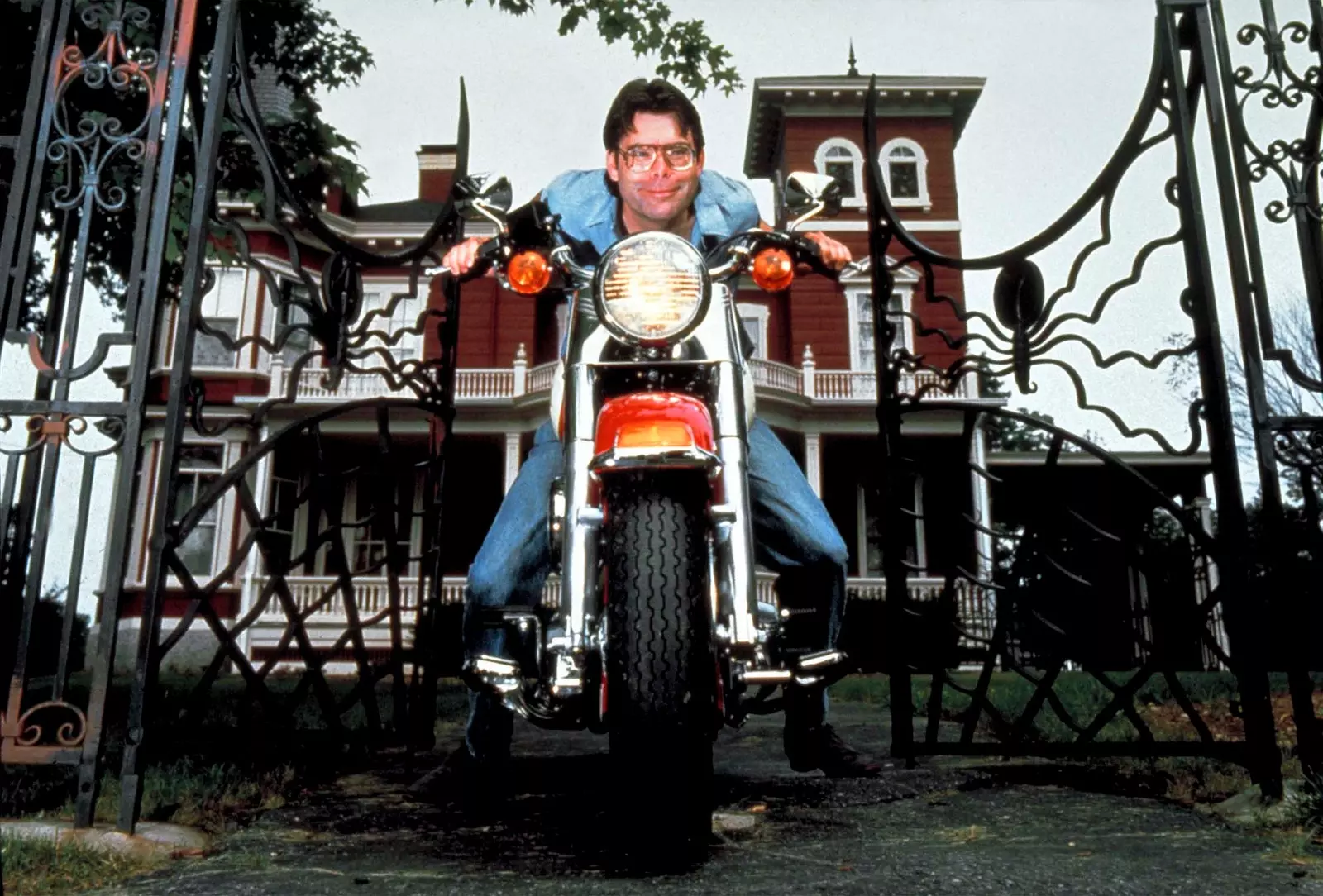 Stephen King posing outside his home for LIFE magazine in 1987