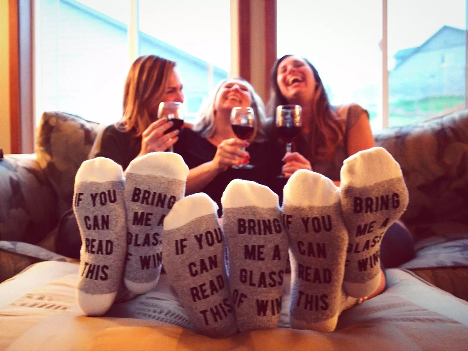 girls drinking at home with funny socks